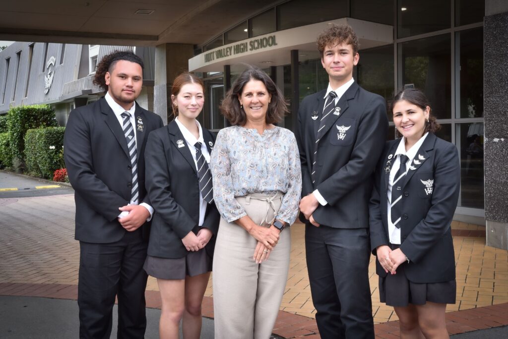 Principal with Head Students welcoming International Students to Hutt Valley High School's entrance.